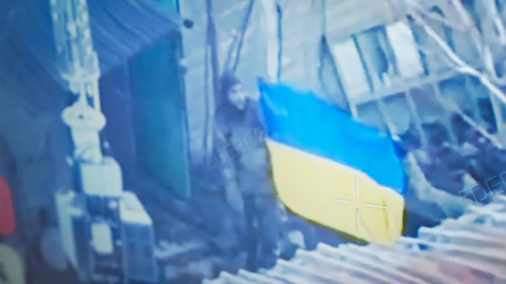 Ukrainian soldiers in Pokrovsk display a Ukrainian flag as proof the city has not fully fallen (BBC/Matthew Goddard)