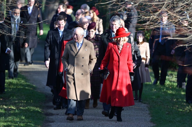 King Charles III and Queen Camilla walk to St. Mary Magdalene Church for Christmas services at Sandringham, Dec. 25, 2025.