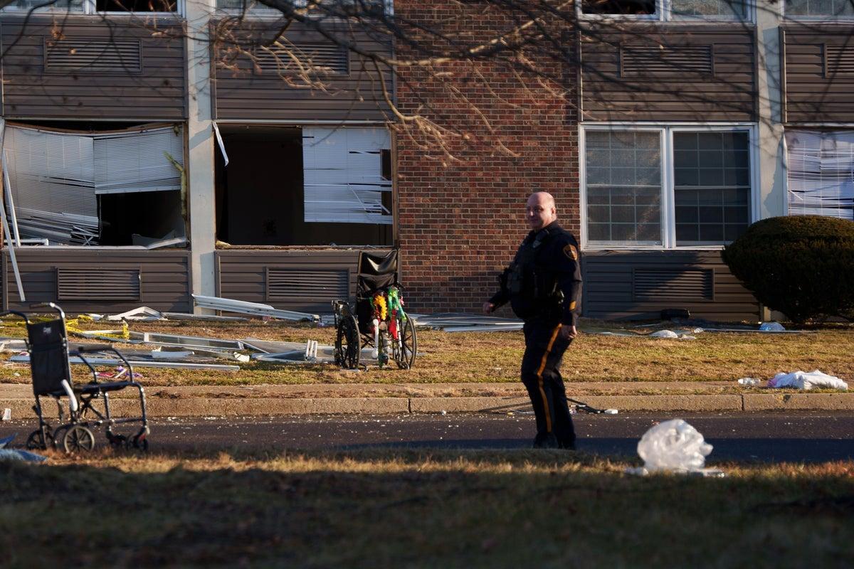 Investigators work amid debris outside a damaged nursing home building in Bristol Township, Pennsylvania, after the explosions.