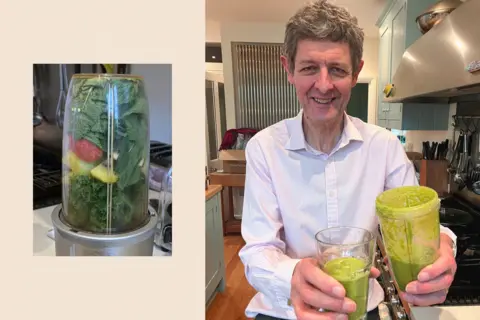 Hugh Pym holding a green smoothie as part of a diet plan while exploring gut health