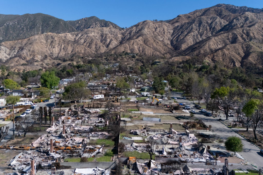 Drone view of workers clearing debris from homes destroyed by the Eaton Fire in Altadena, March 10, 2025. Photo: Mike Blake/REUTERS