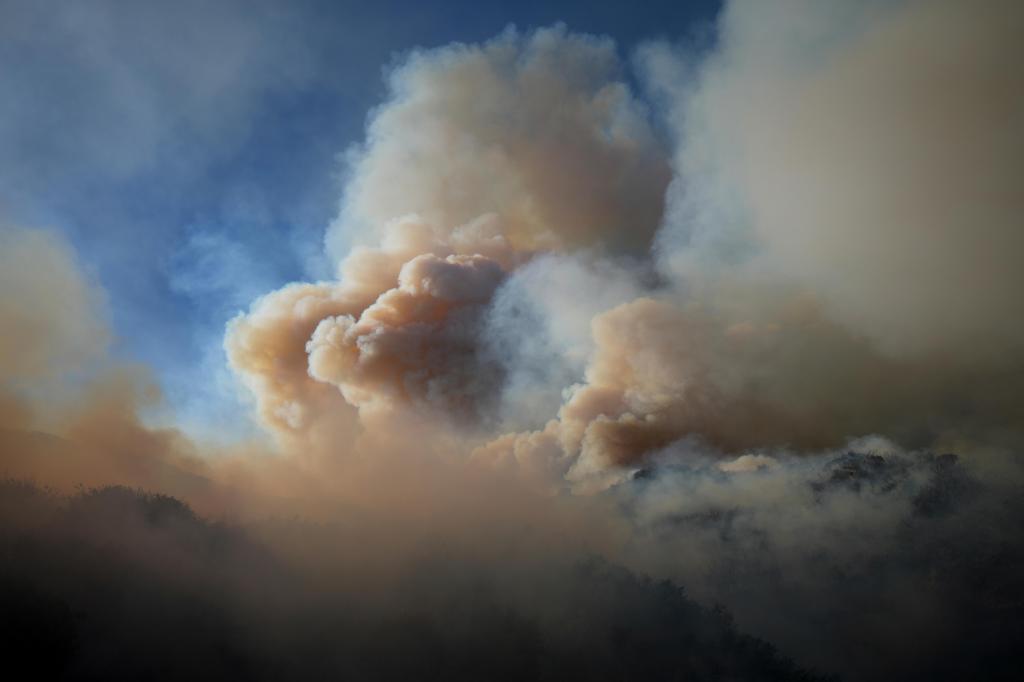 Hazy skies from wildfire smoke, illustrating PM2.5 air pollution and health concerns.