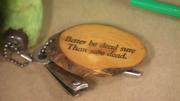 Keychain recovered from Mary Kay Heese's purse reading 'Better be dead sure Than sure dead'
