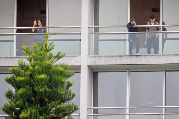 Members of Iran's women's soccer team on balconies at the Royal Pines Resort on Australia's Gold Coast, March 9, 2026.
