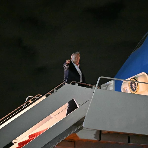 President Trump boards Air Force One before departing Joint Base Andrews in Maryland to fly to Evian-les-Bains, France, for the G7 summit on Monday. - Mandel Ngan/AFP via Getty Images