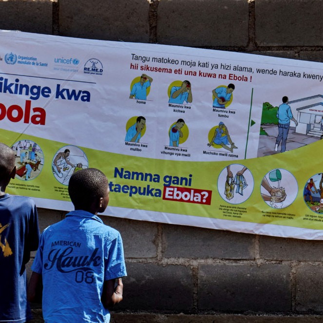 LEFT: FILE PHOTO: Congolese children Ibrah Asimwe and Alex Uketi read an advocacy poster as aid agencies intensify efforts to contain a new Ebola outbreak involving the Bundibugyo strain outbreak, in Bunia, Ituri province, Democratic Republic of Congo, May 20, 2026. File photo by Gradel Muyisa Mumbere/Reuters - Gradel Muyisa Mumbere/Reuters